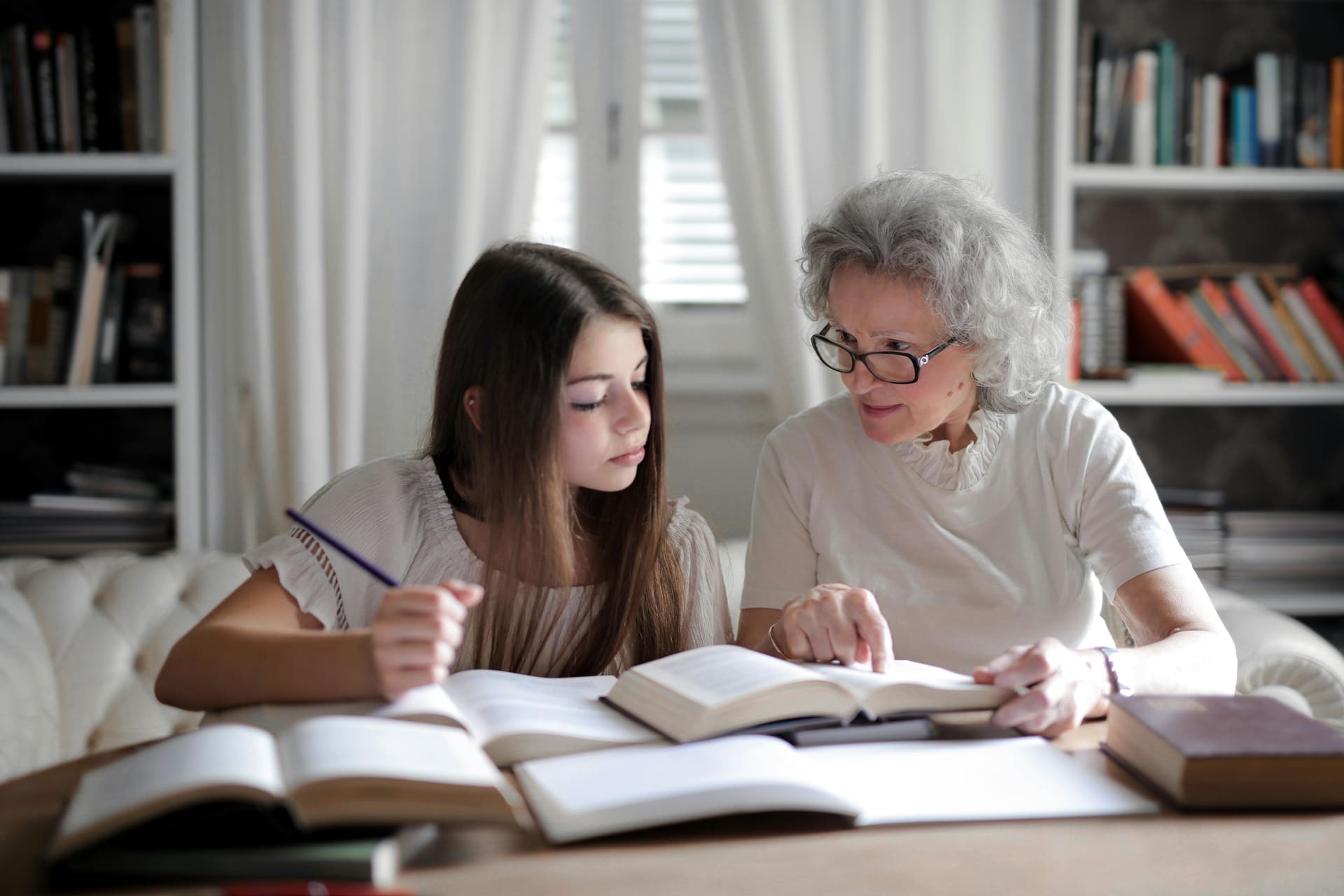 Private tutor helping a student with homework