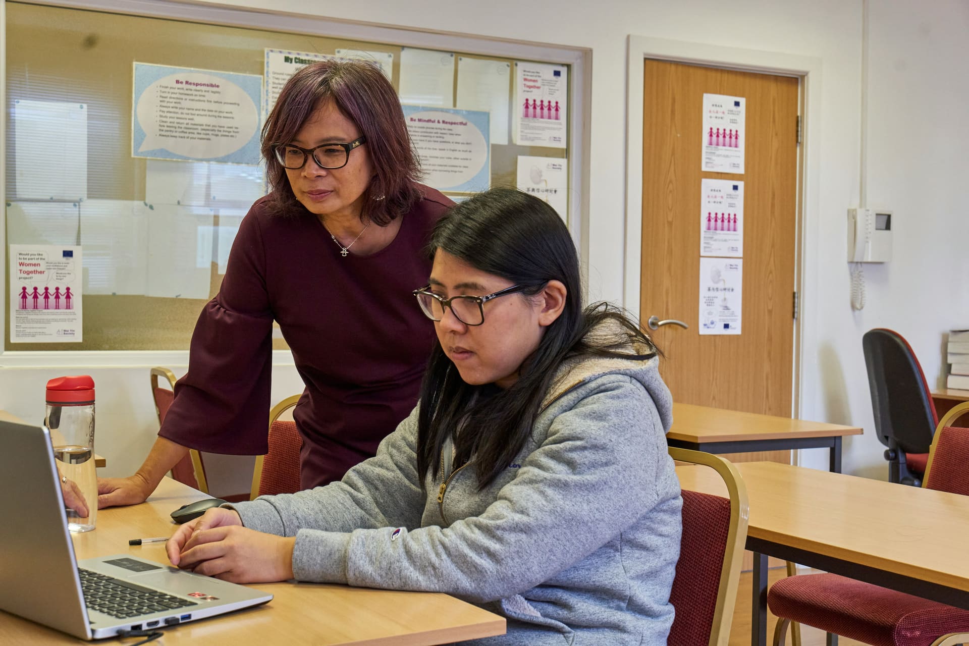 Private tutor reviewing school work with a student